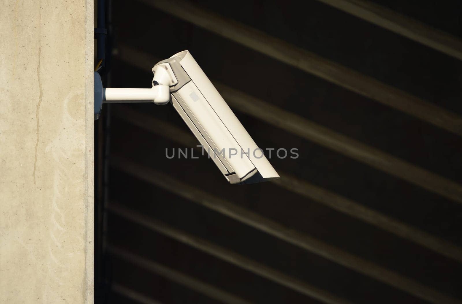 Overhead security camera in heavily guarded industrial area