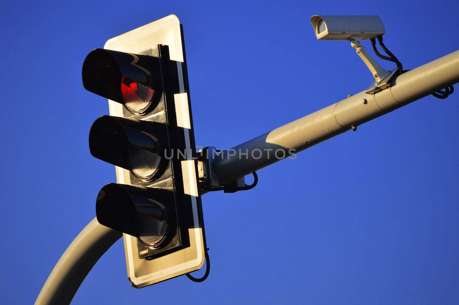 Traffic lights over a blue sky