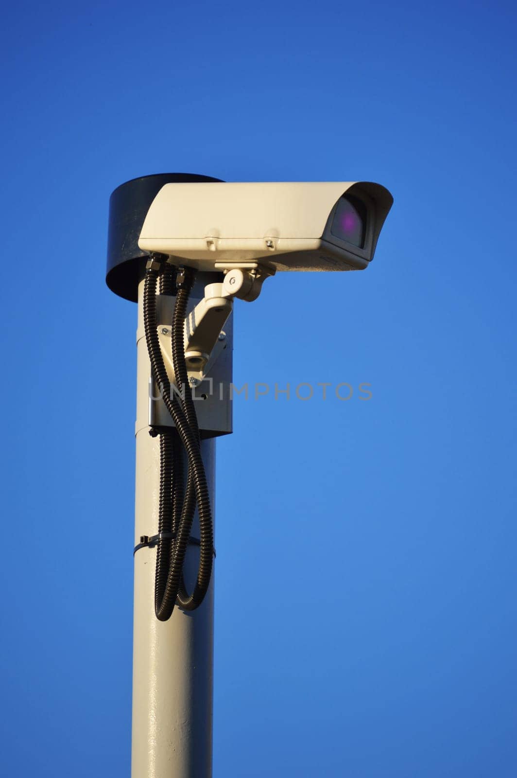 Security camera over a blue sky