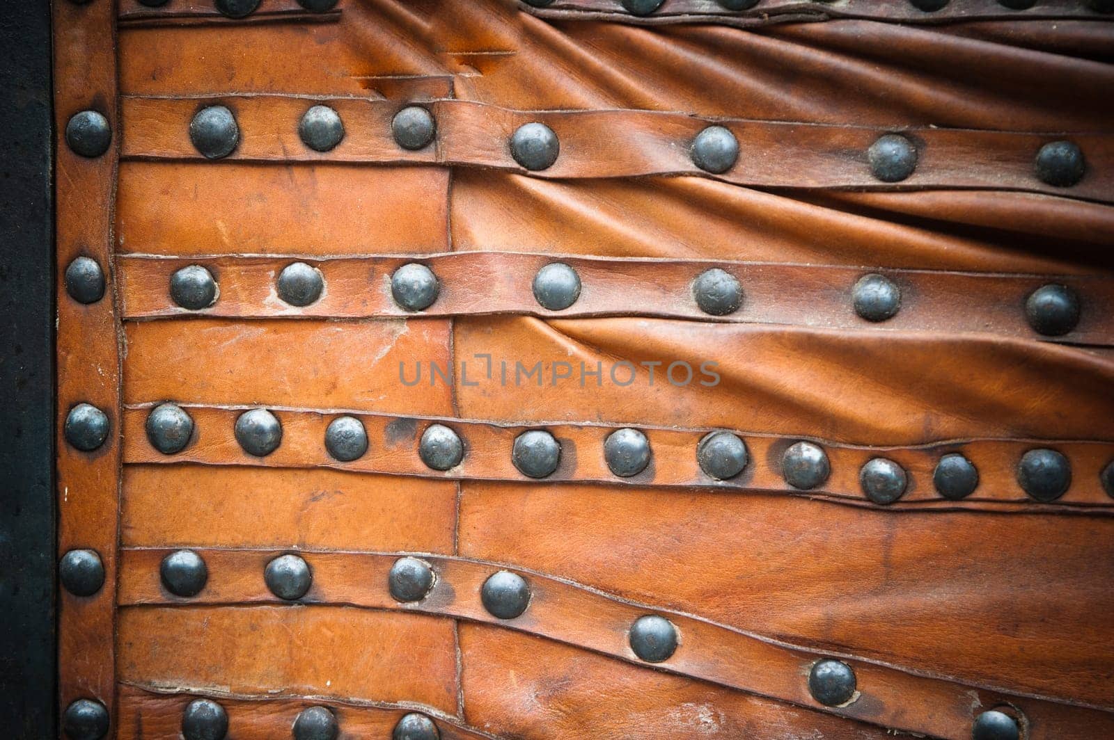 background from the skin with a wrought-iron rivets