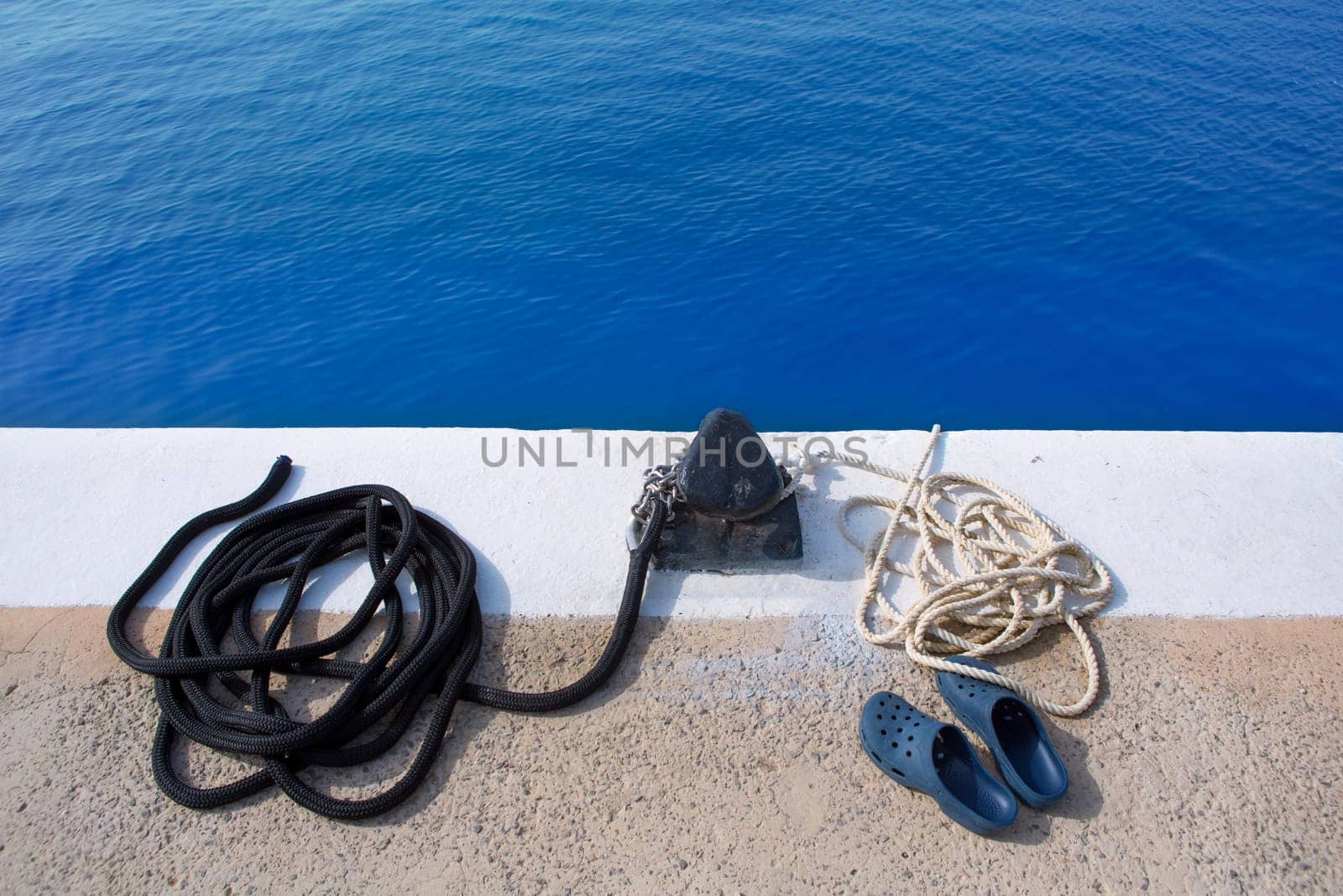 Boat noray marine rope and shoes in marina port