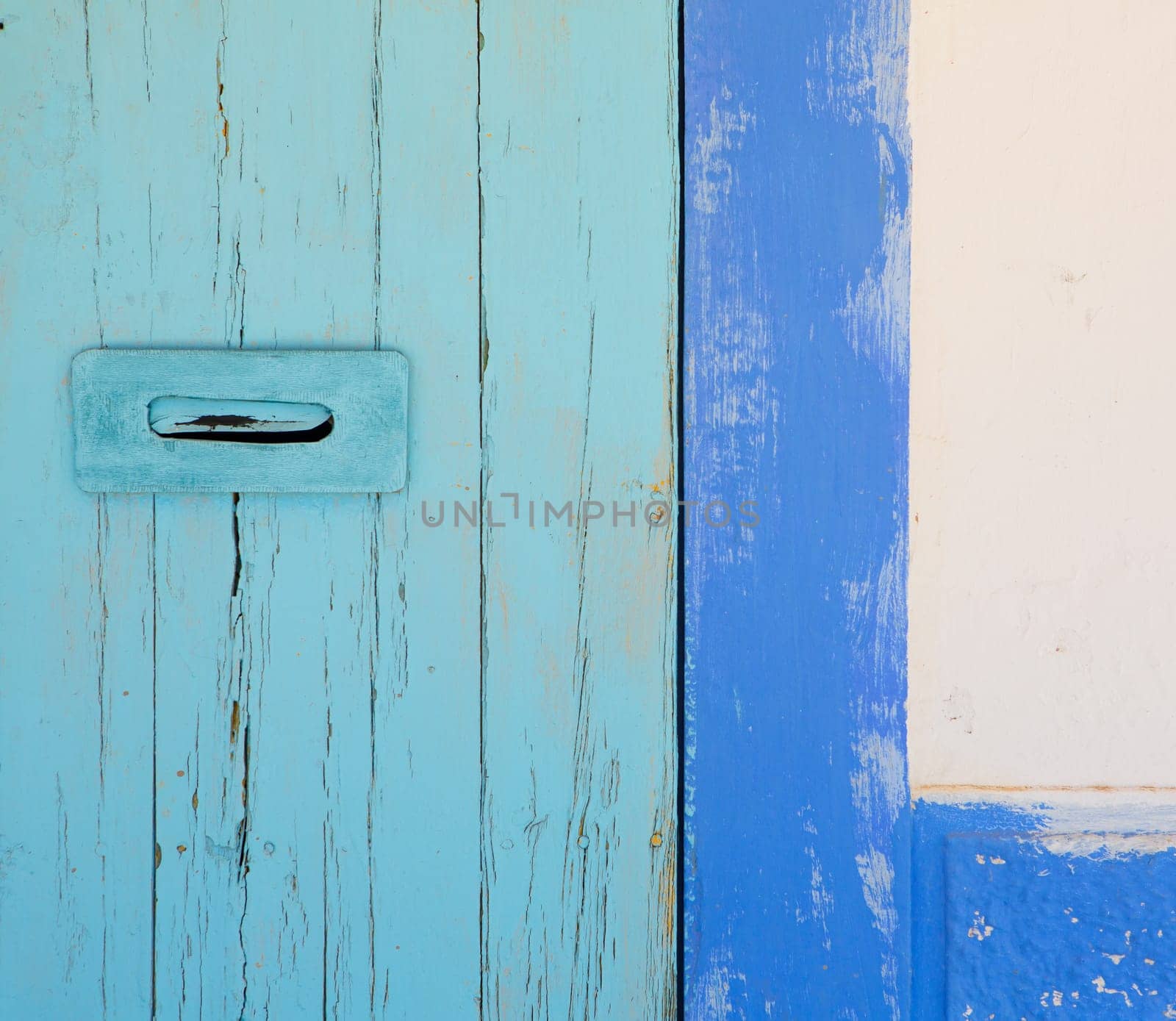 Blue and turquoise mediterranean door in Ibiza formentera