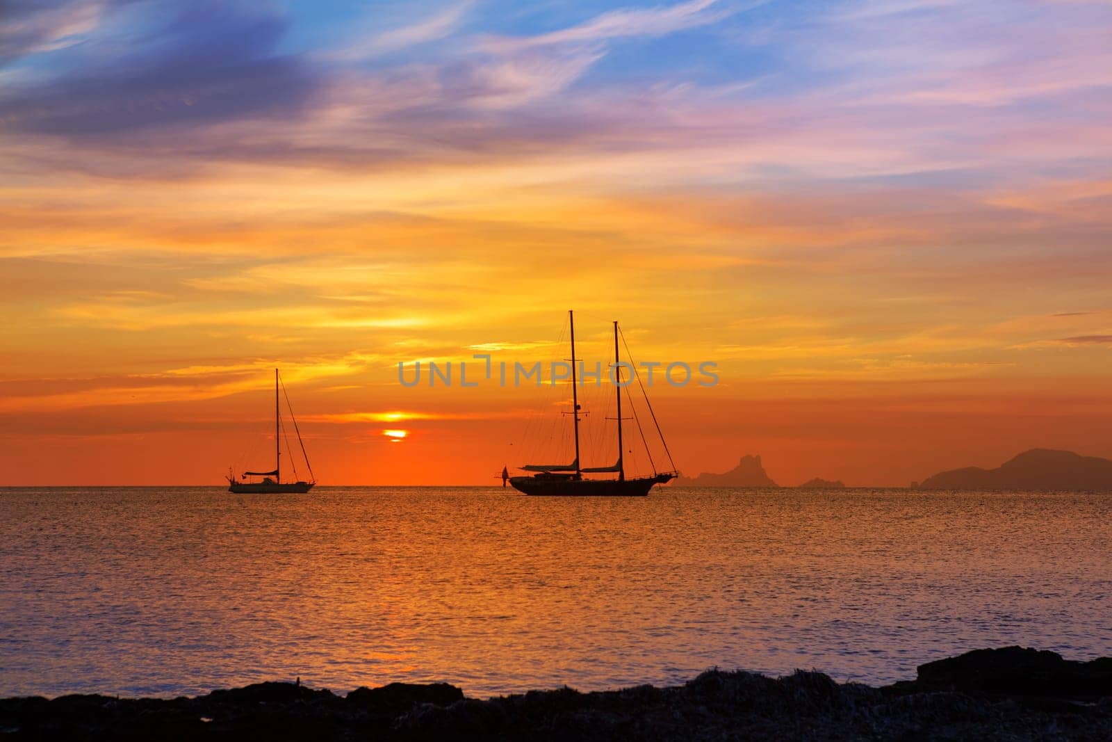 colorful sunset of Ibiza view from formentera with Es Vedra