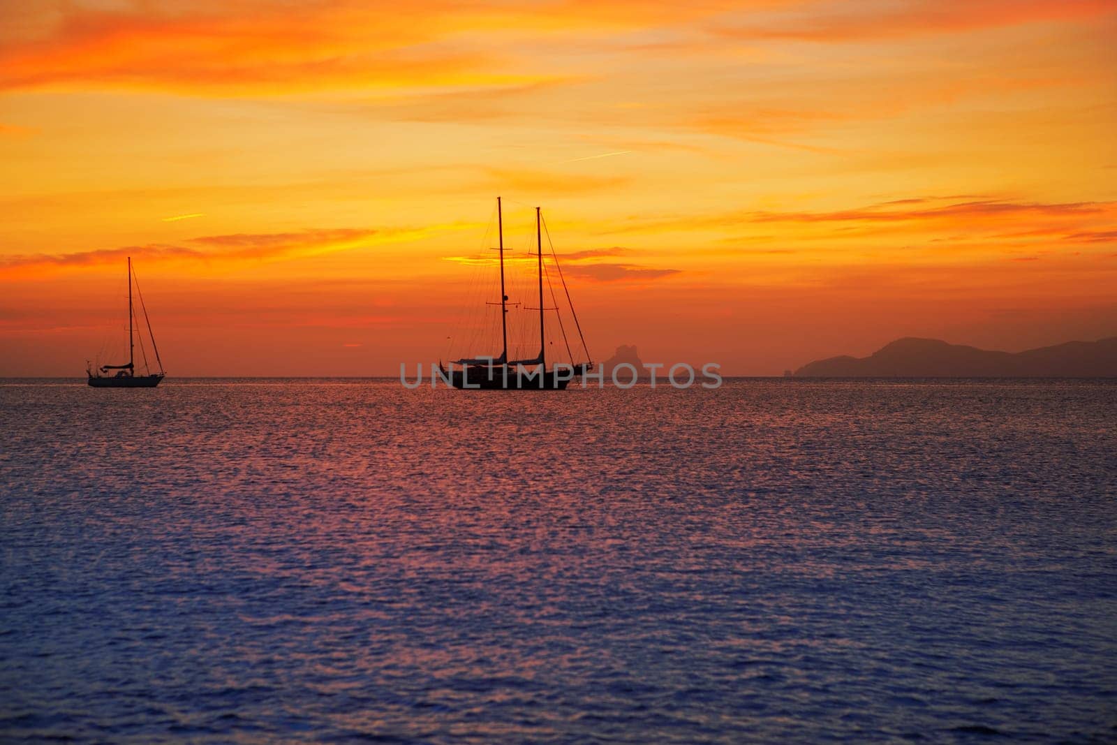 colorful sunset of Ibiza view from formentera with Es Vedra