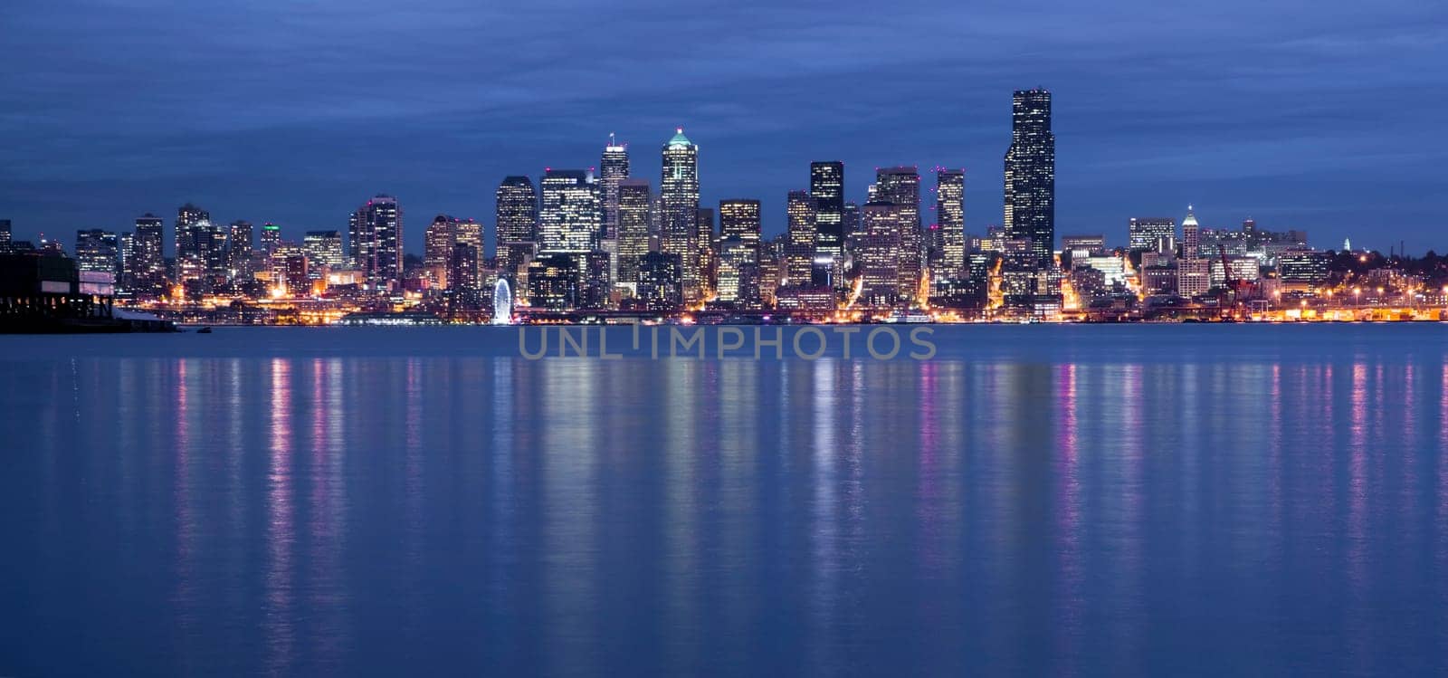 Seattle from the West Side as night falls with a storm moving in