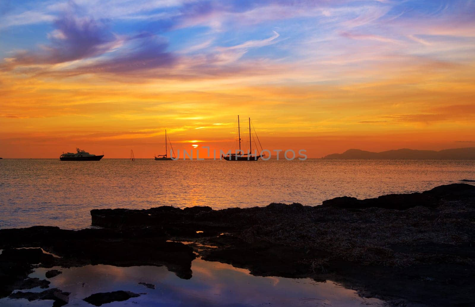 colorful sunset of Ibiza view from formentera with Es Vedra