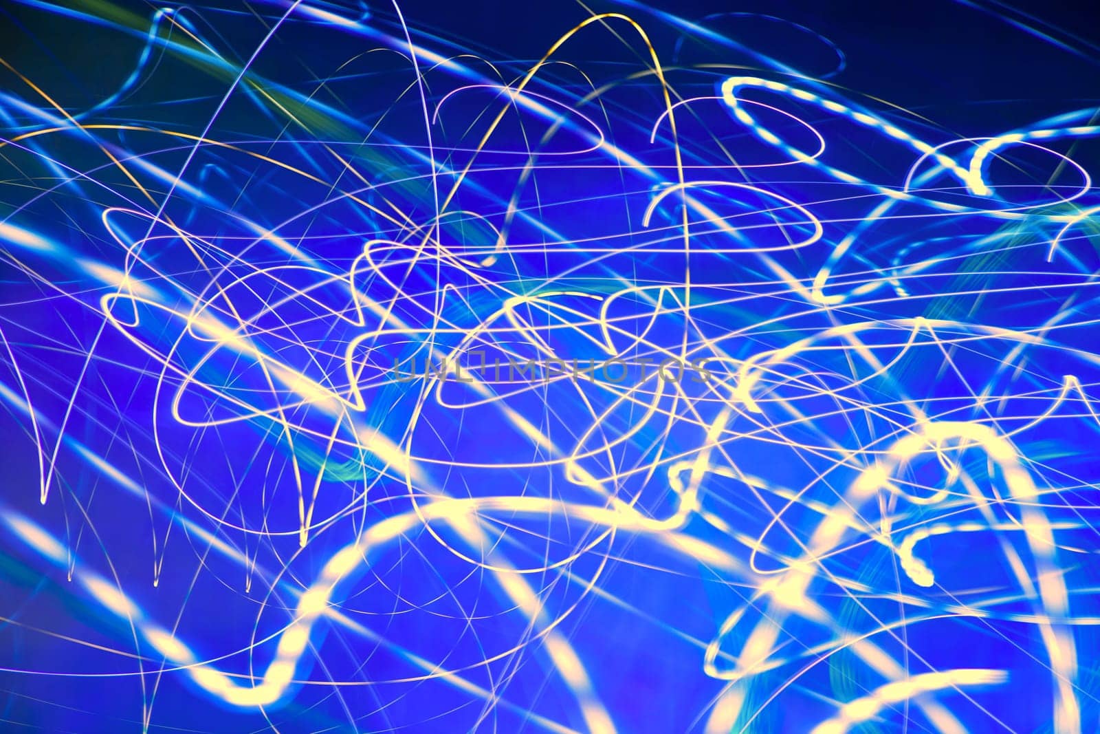 Abstract motion blurred lights on blue background