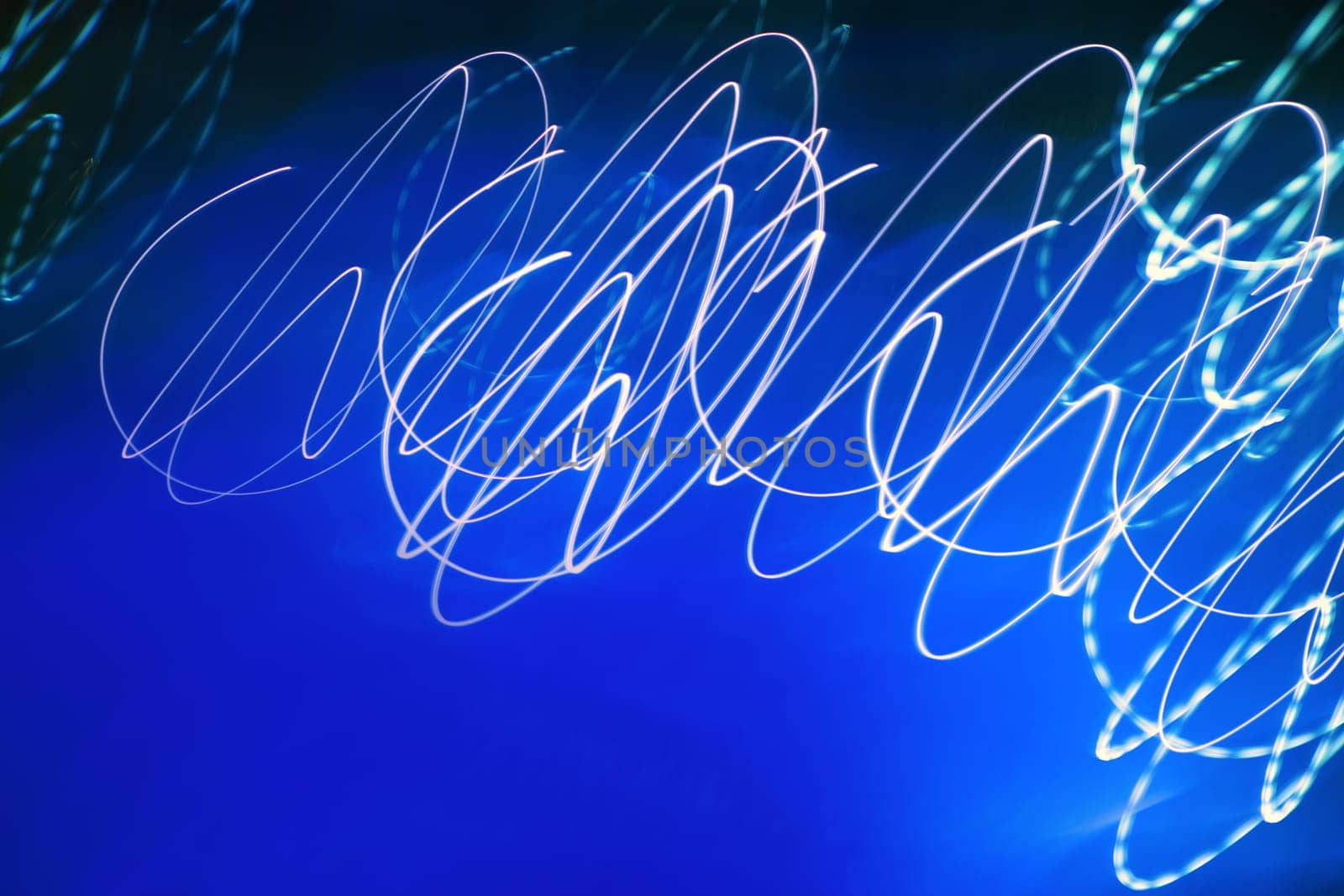 Abstract motion blurred lights on blue background