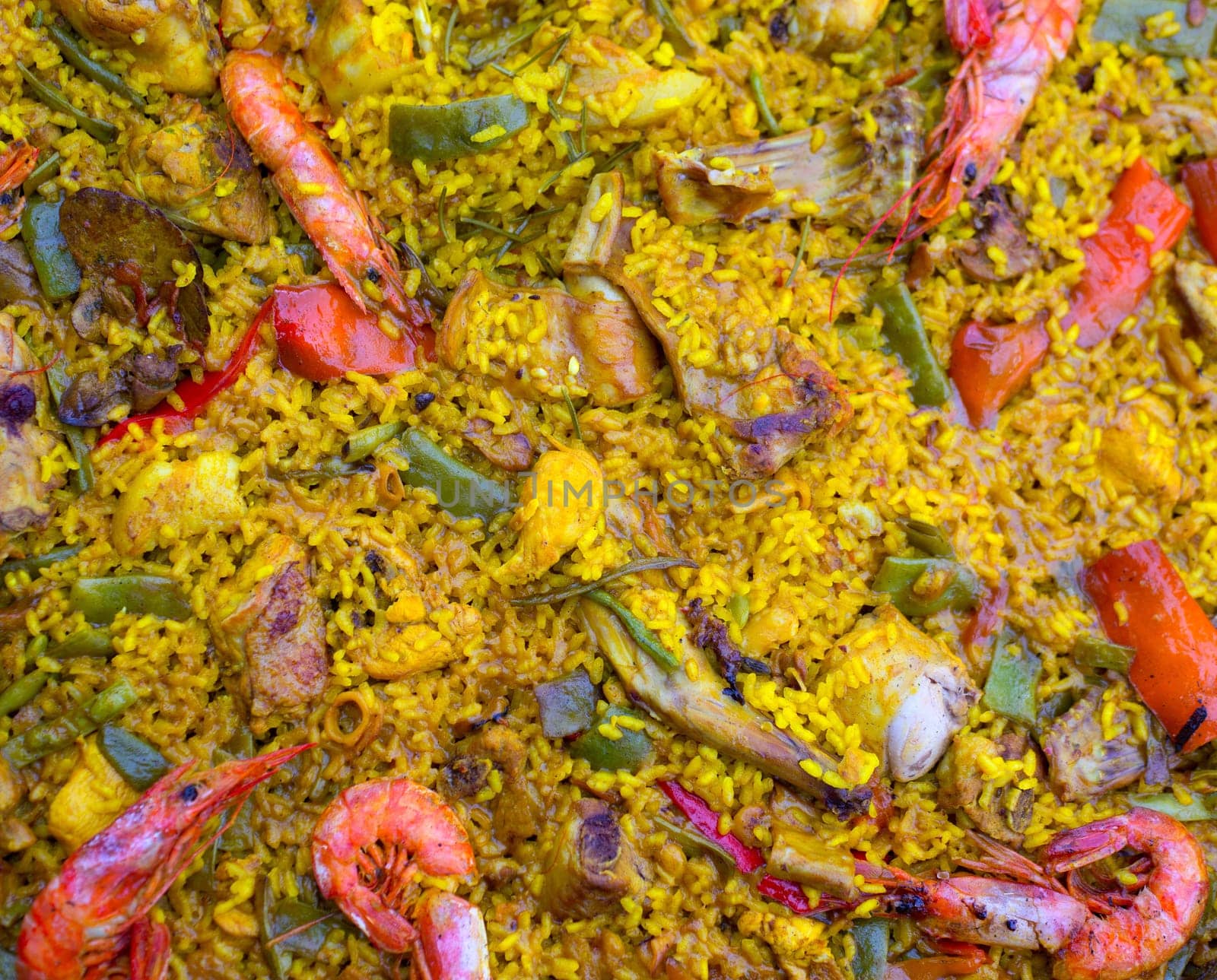 Spanish rice paella mixed of meat and seafood in Valencian community