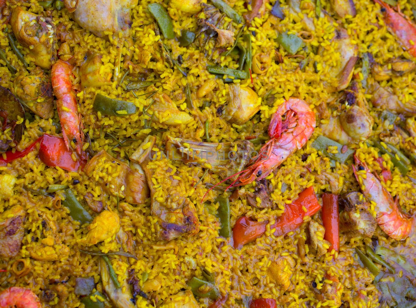Spanish rice paella mixed of meat and seafood in Valencian community
