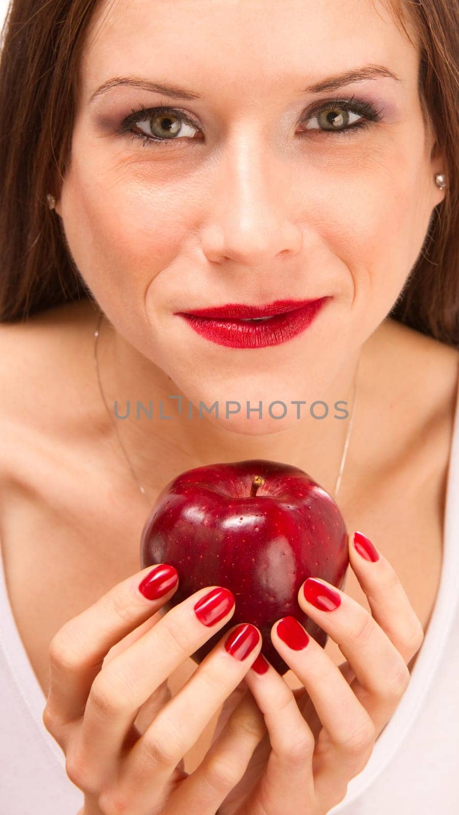 Beautiful Woman holds a Red Delicious Apple