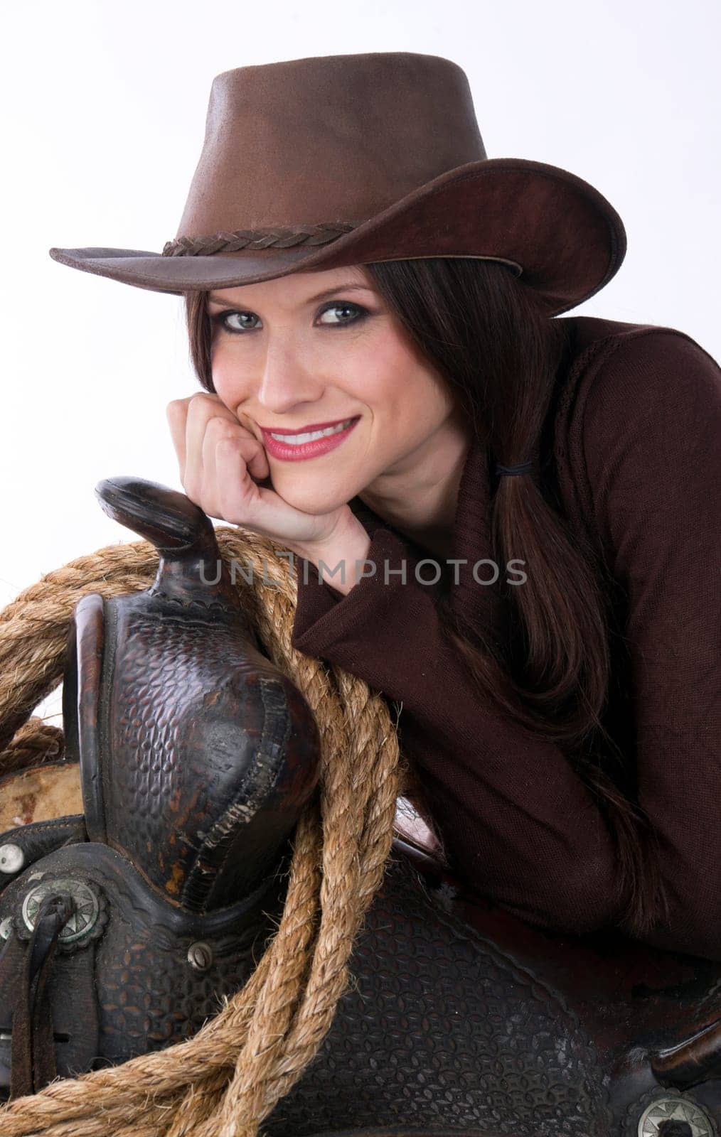 A woman relaxes against her gear