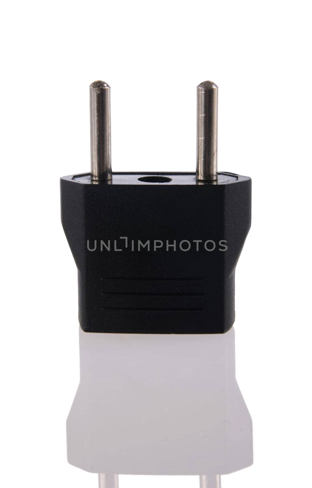 Power plug adapter close up with its reflection isolated on white background. Included clipping path, so you can easily cut it out and place over the top of a design.