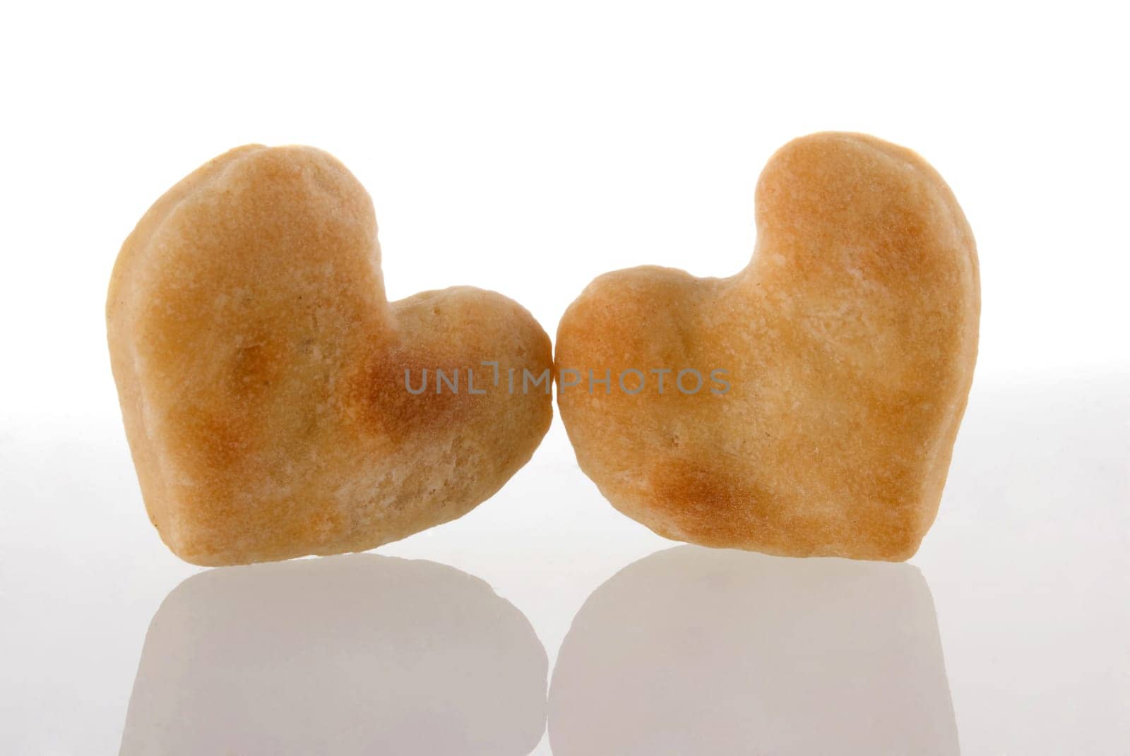 Two heart cookies isolated and its reflection on white background.  Included clipping path, so you can easily cut it out and place over the top of a design.