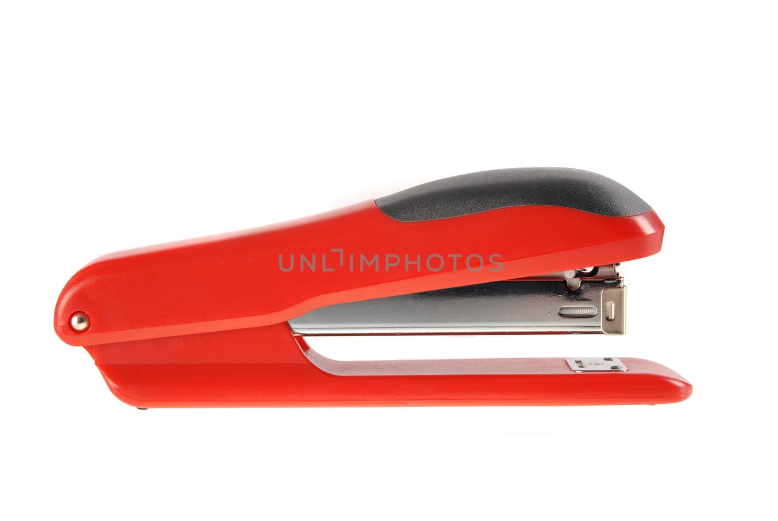 A red and black stapler isolated on white background.  Included clipping path, so you can easily cut it out and place over the top of a design.