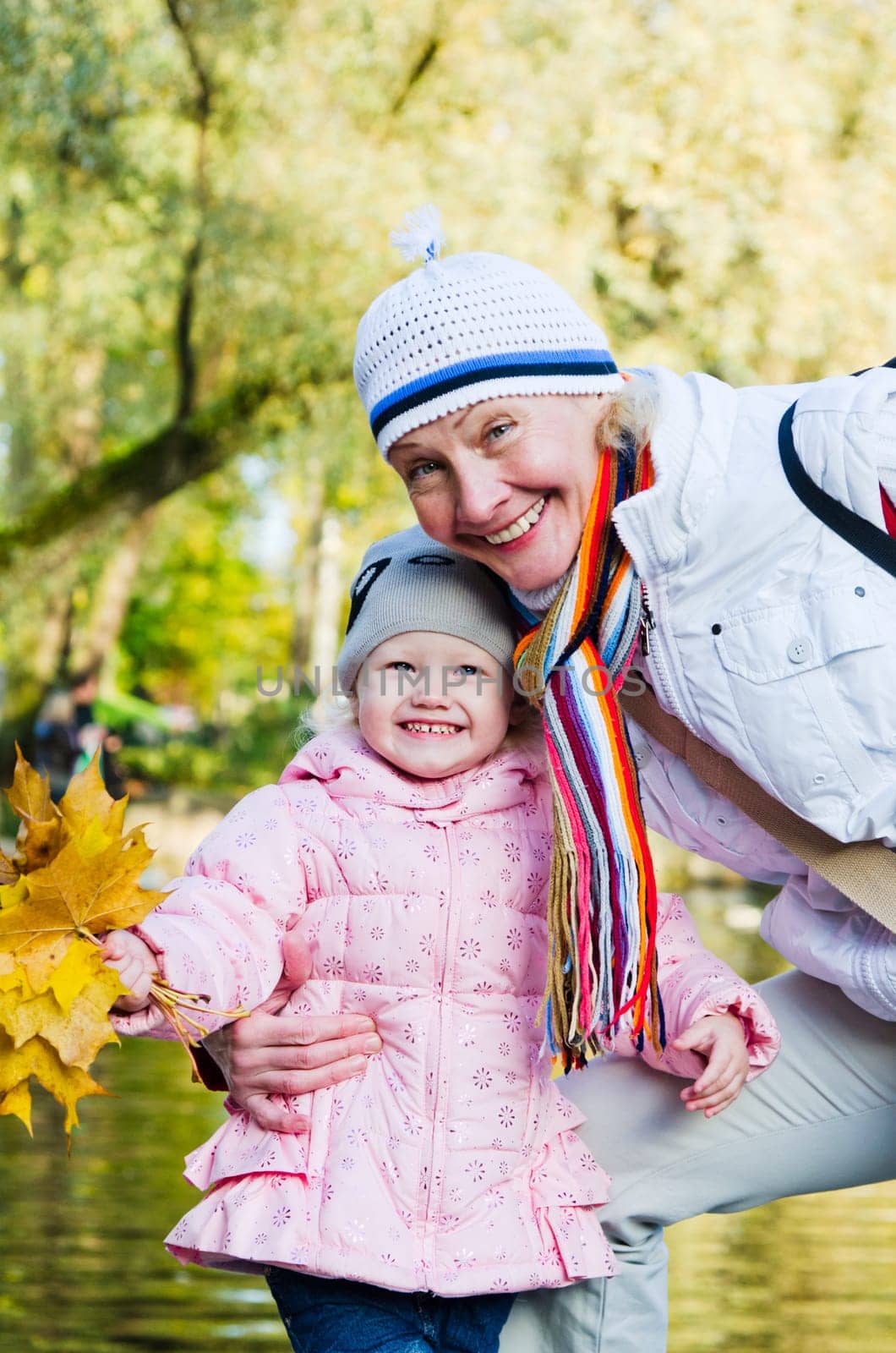 grandmother with the grand daughter in autumn park