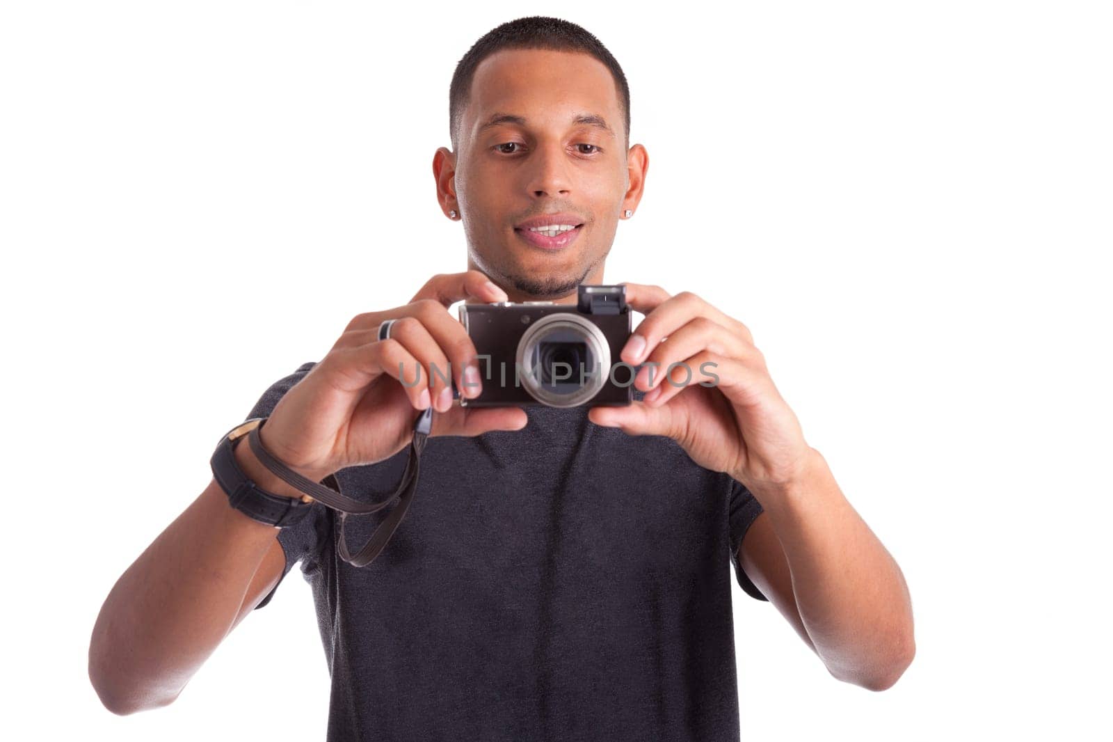 Portrait of a young african american man holding and taking a picture, isolated on white background