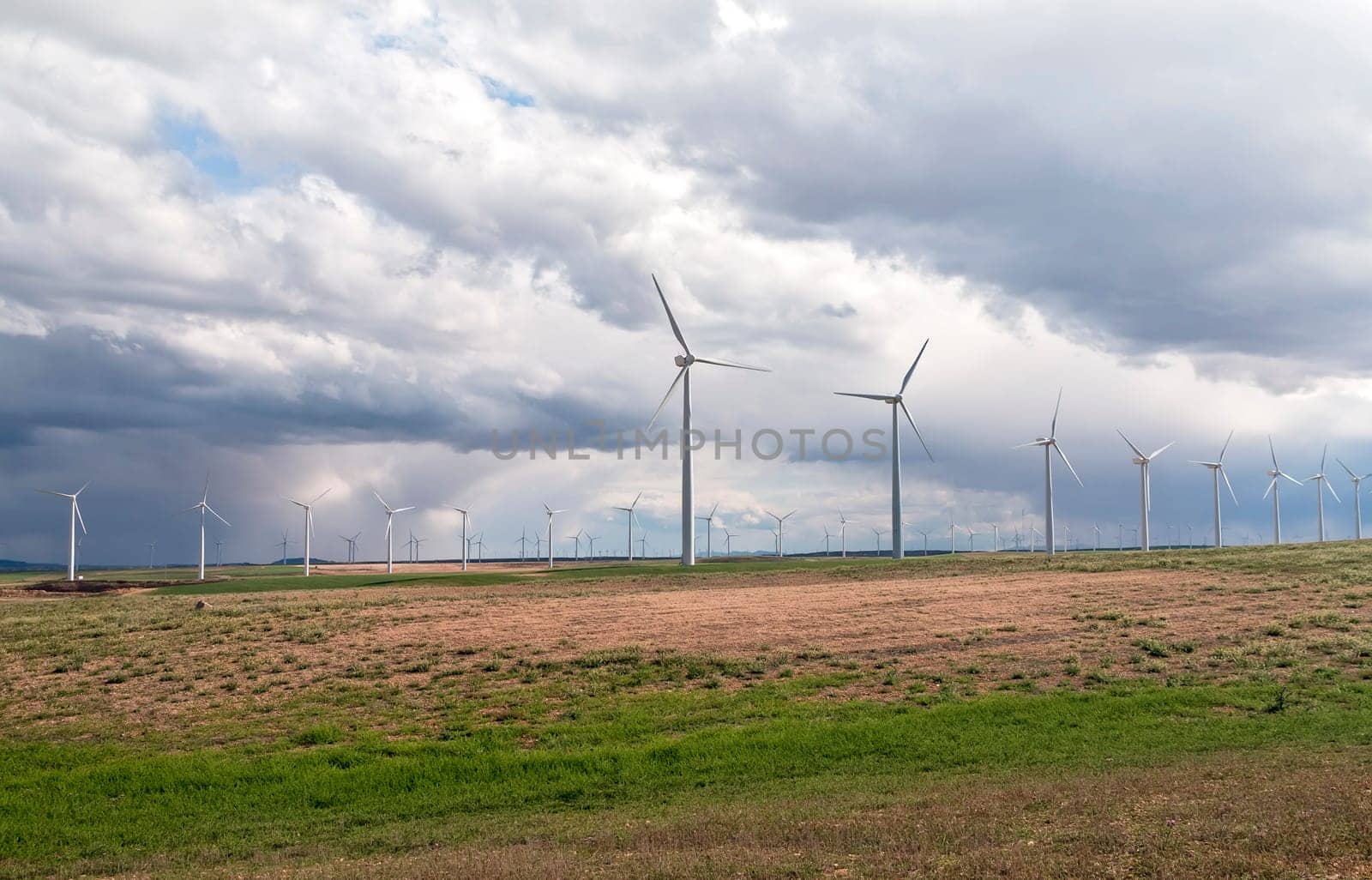 Wind Generators sit atop the hills collecting electricity from the wind