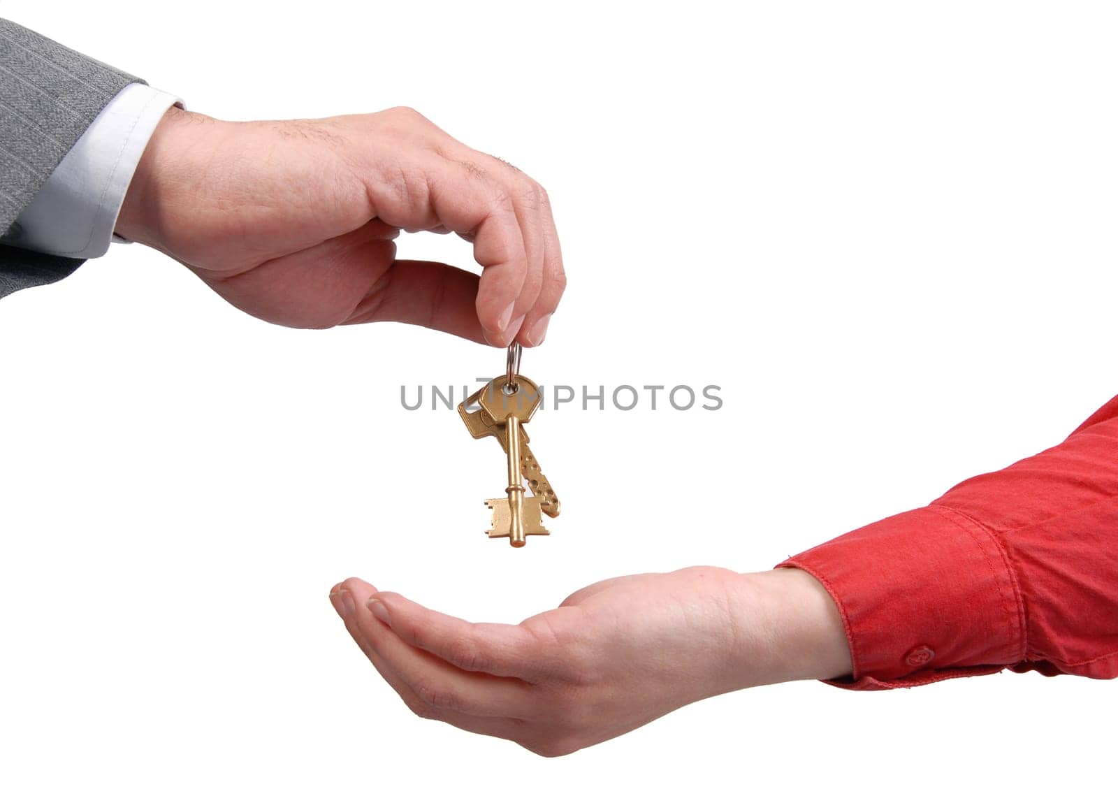 Businessman handing a key to success over a woman palm.