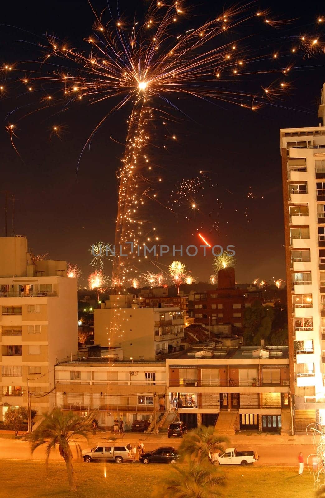 Night scene of Christmas fireworks celebration over the buildings. Montevideo, Uruguay.