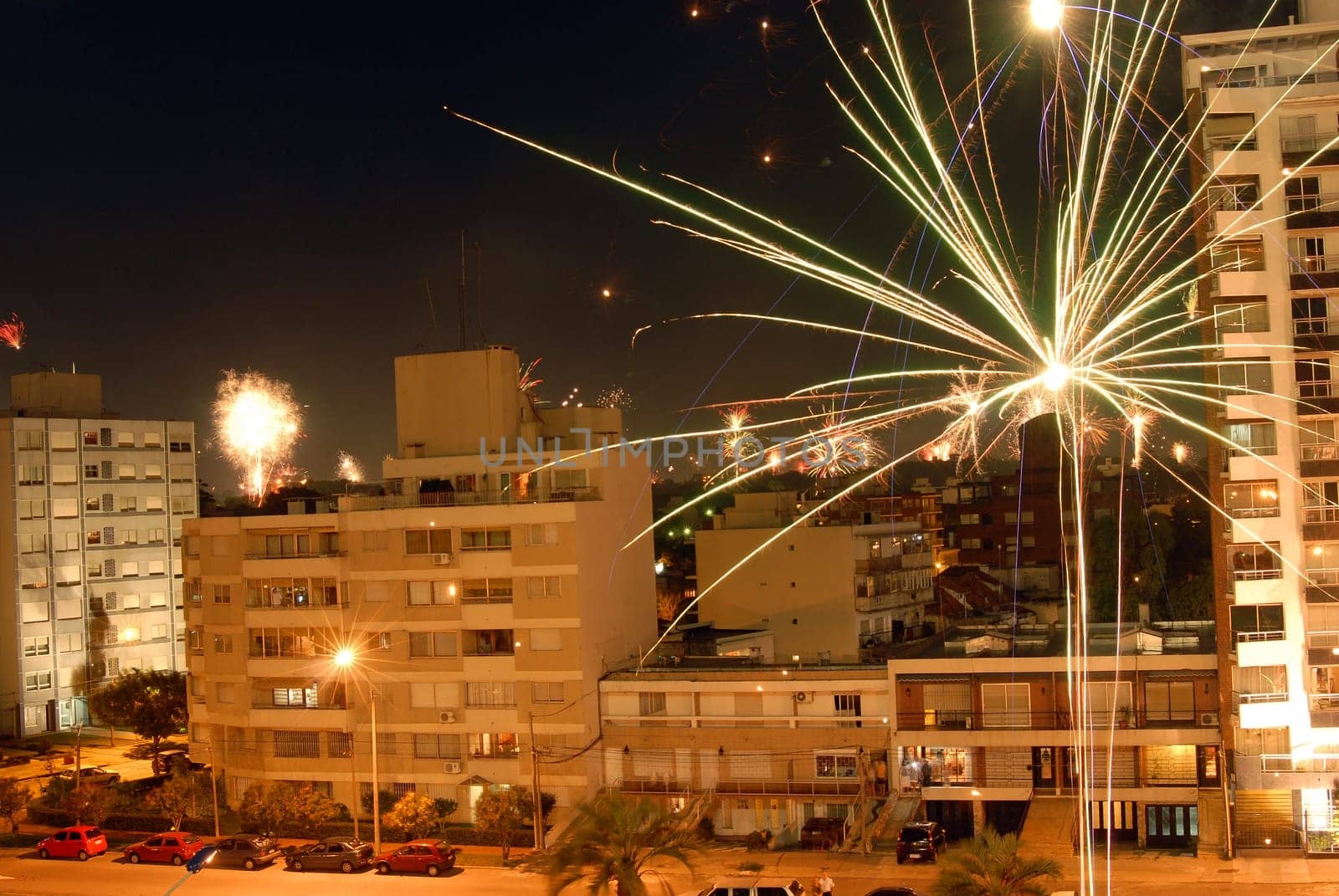 Beautiful night scene fireworks celebration of new year 2010 with fireworks over the buildings. Montevideo, Uruguay