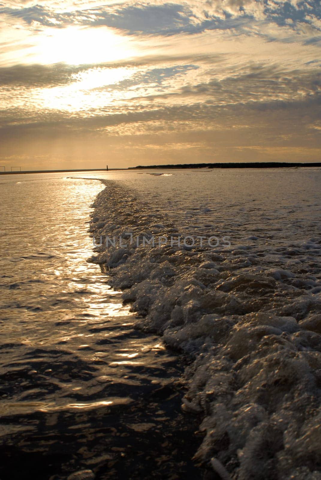 Cloudy dramatic dawn seascape at Montevideo city bay, Uruguay. Vertical picture from the water with nobody.