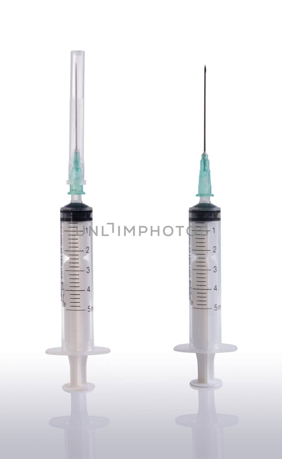 Two syringes and needle with its reflection on clear background.  Included clipping path in every object, so you can easily cut it out and place over the top of a design