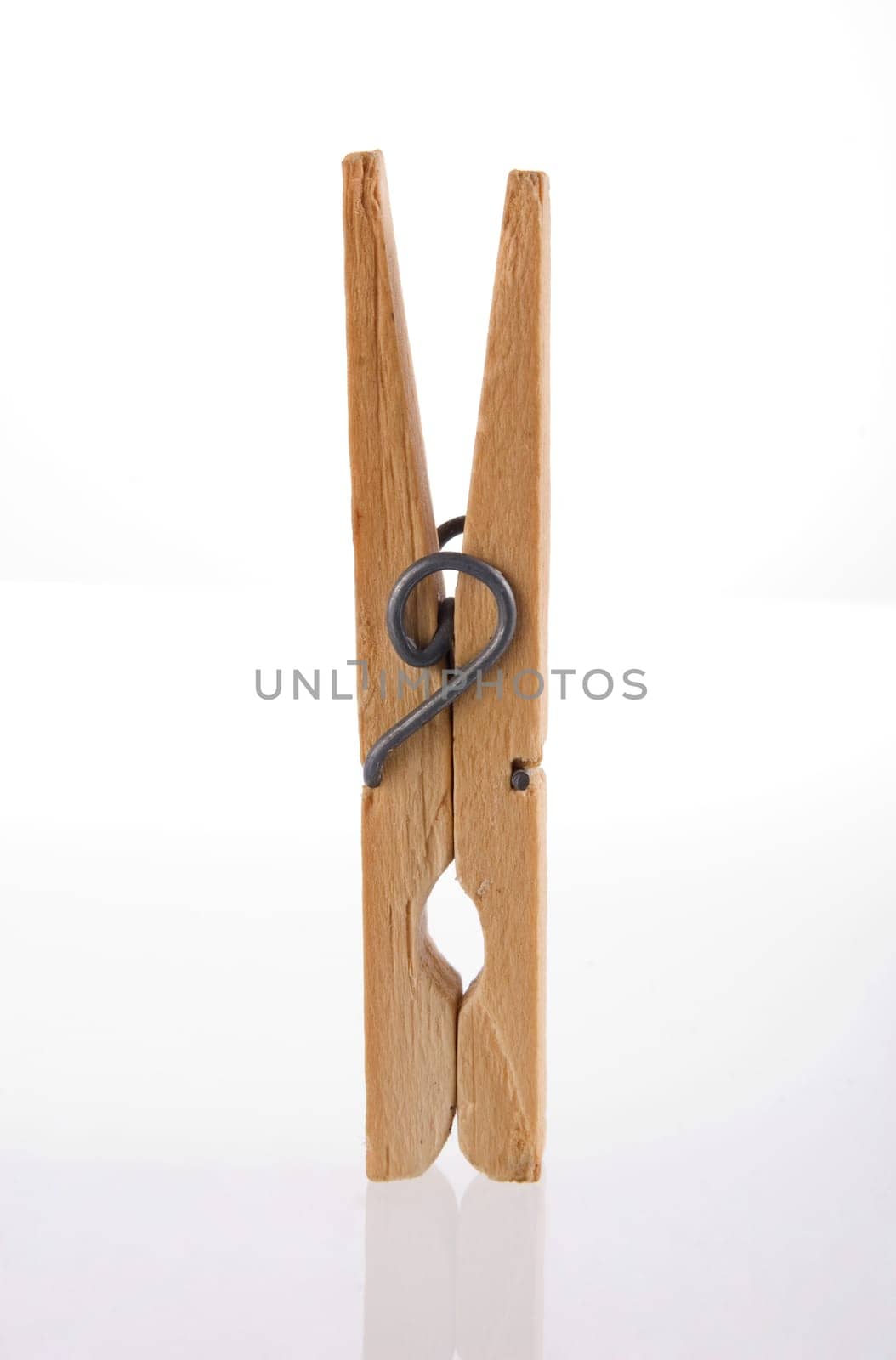 Clothes peg isolated with its reflection on white background.  Included clipping path, so you can easily cut it out and place over the top of a design.