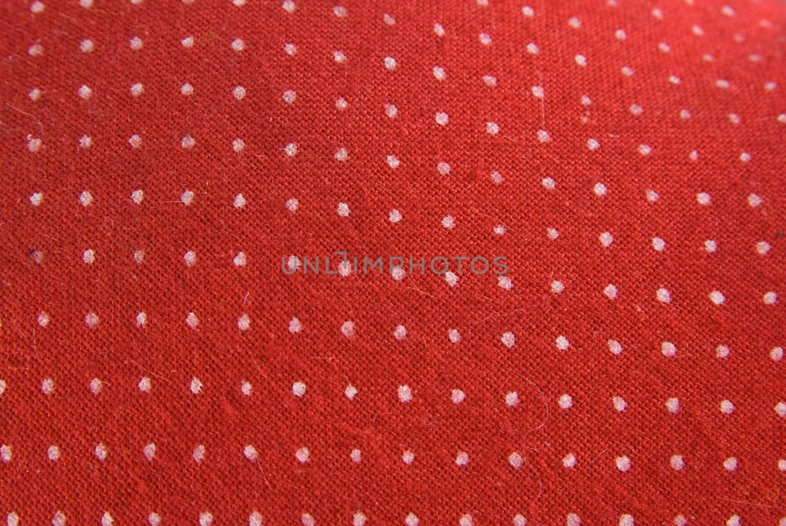 Retro red cloth with white dots as background.