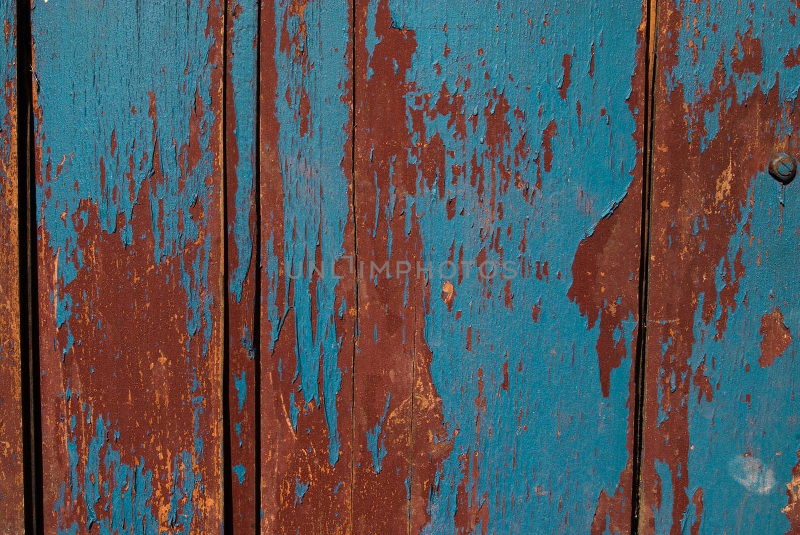 Vintage wooden texture with grunge paint close up. Useful as background for design works.