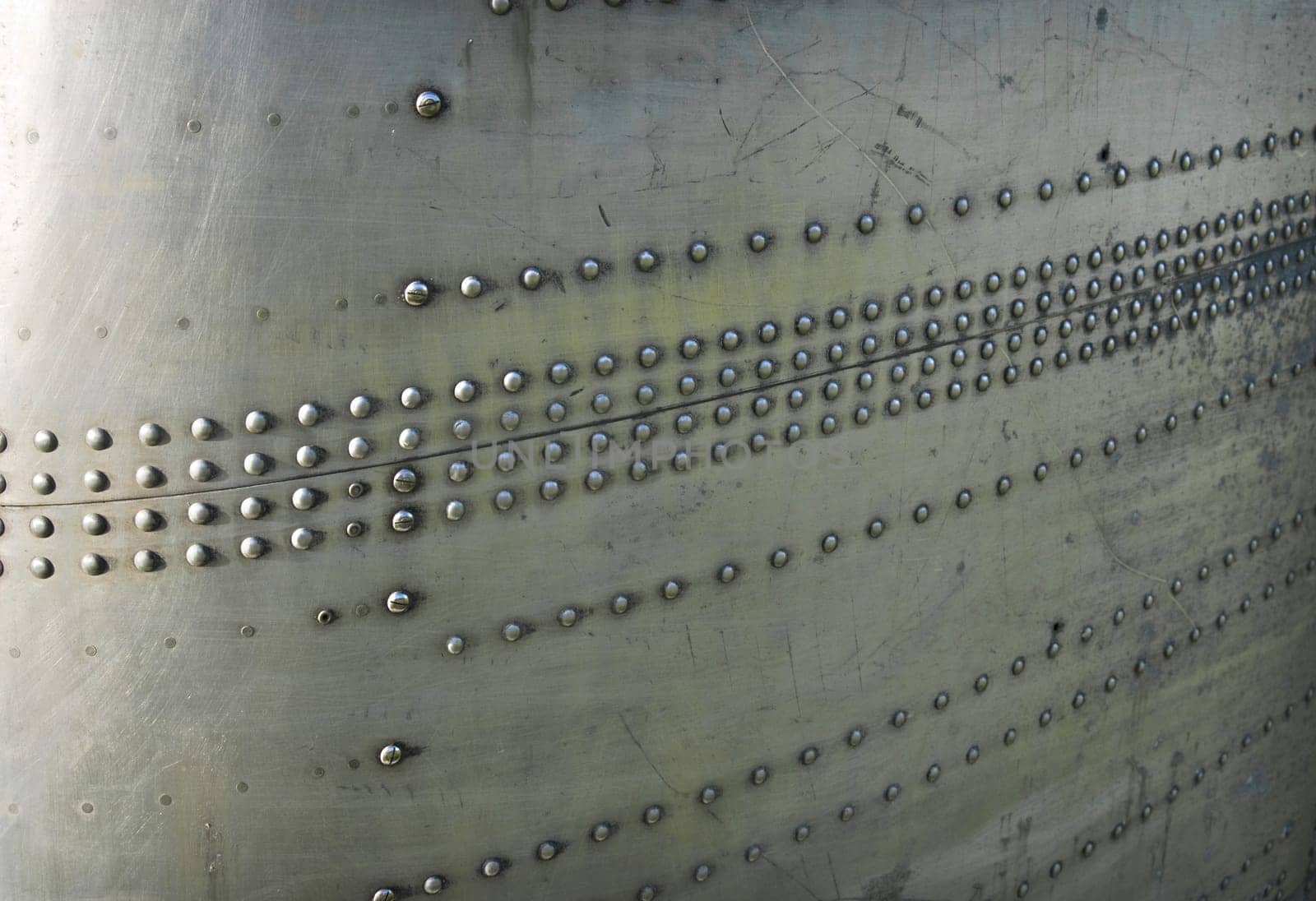 Silvel metal texture with rivets and screws. Useful as background for design works.