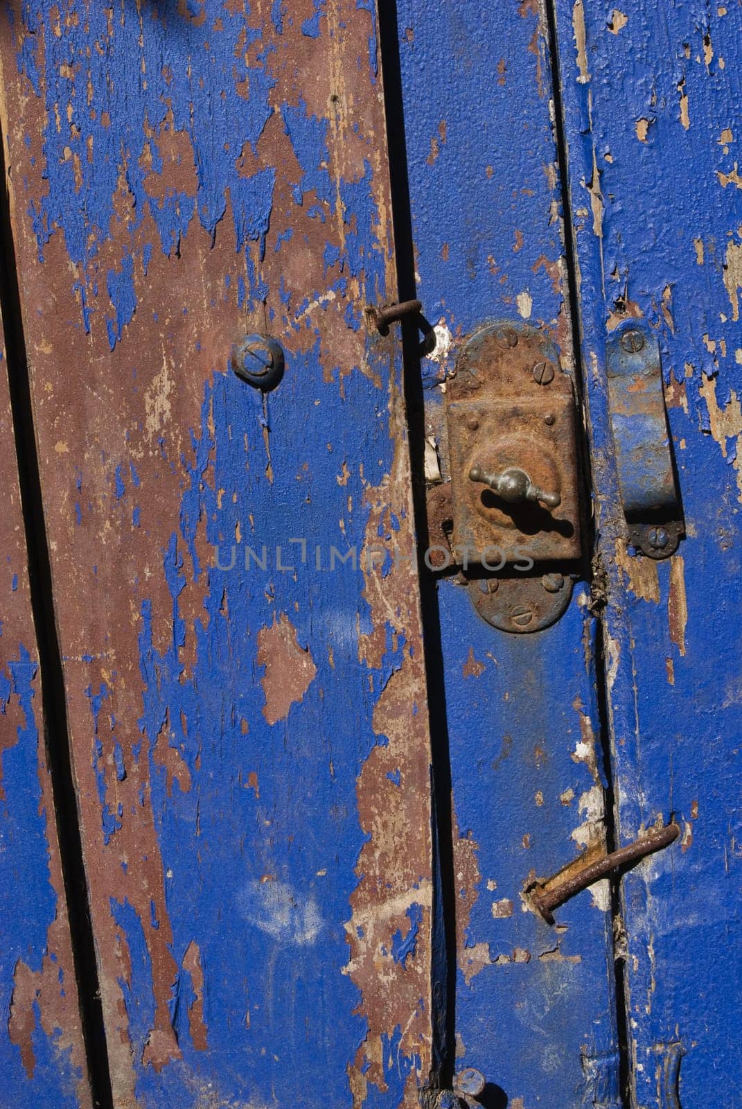 Vintage wooden blue door close up. Useful as background for design works.