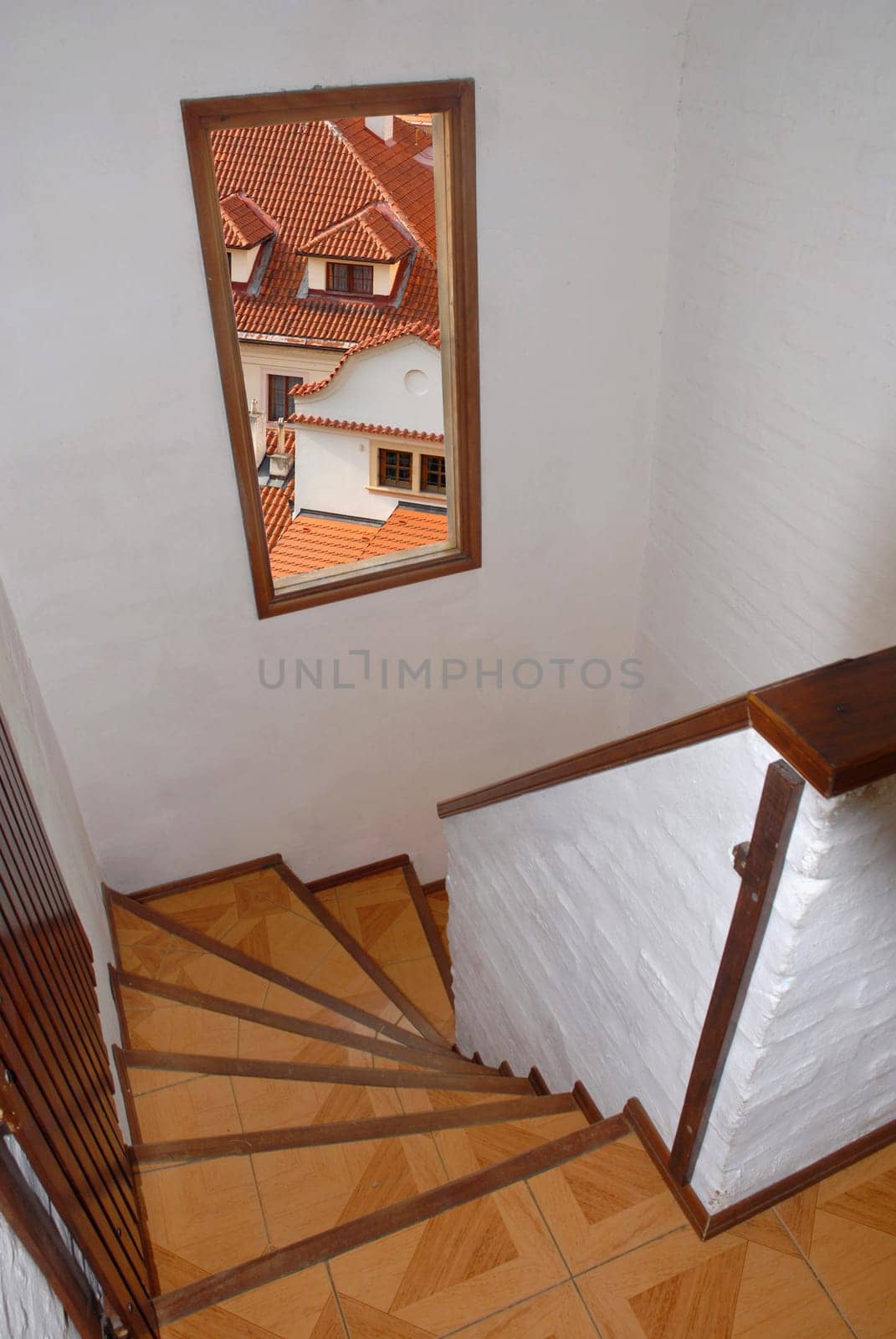 staircase with window with view to city roofs