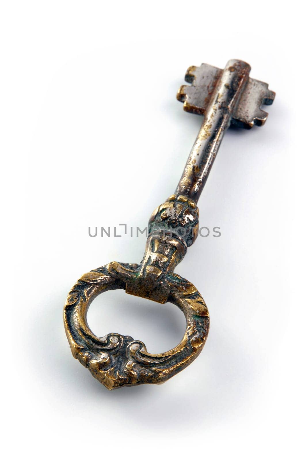 Vintage ancient key over white background.