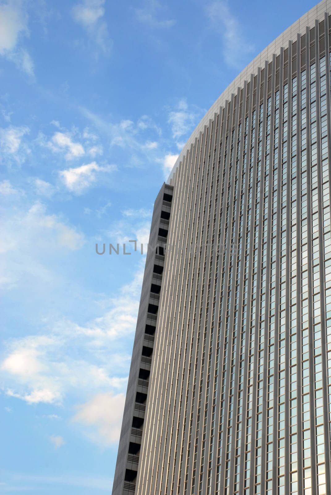 The top of a skyscraper on a blue sky background
