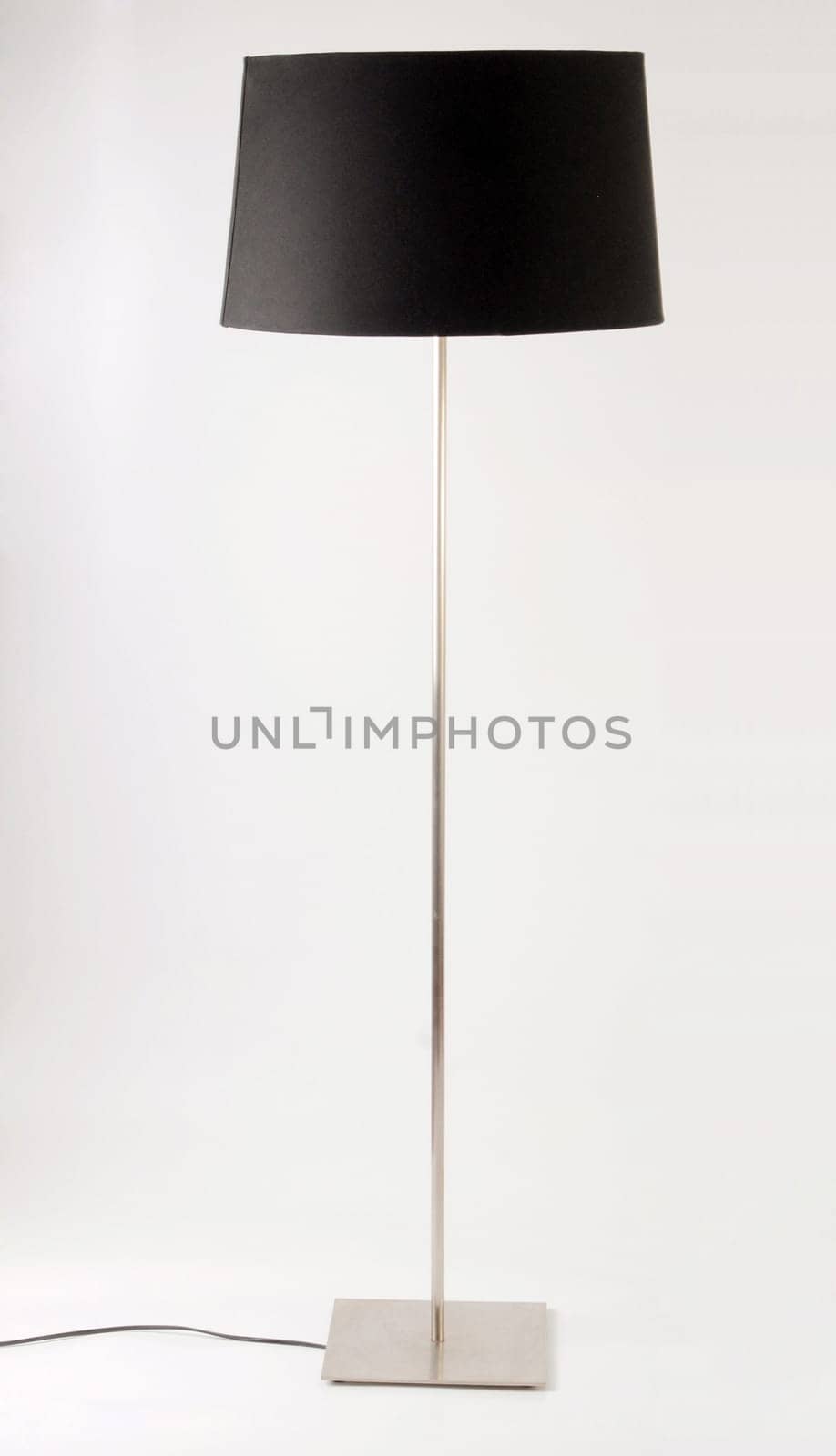 Contemporary black and metallic floor lamp. Isolated on white