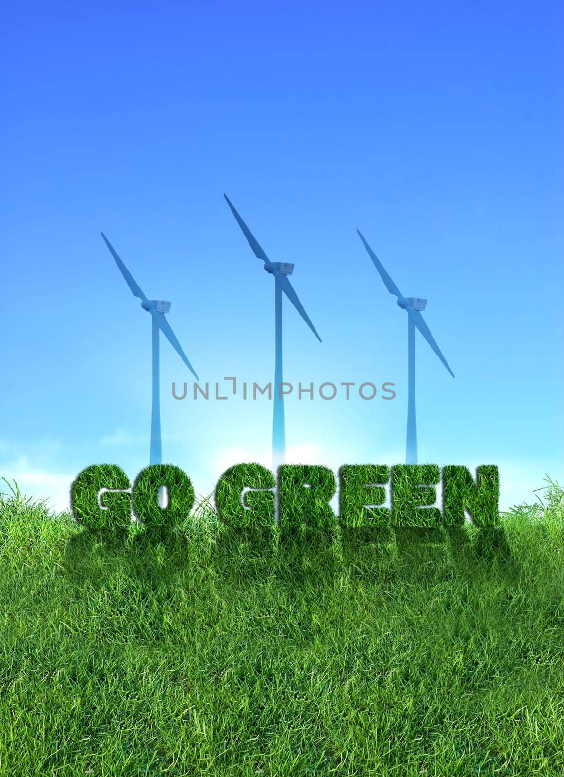 Textured go green sign over fresh grass. Wind turbines over clear blue sky background.