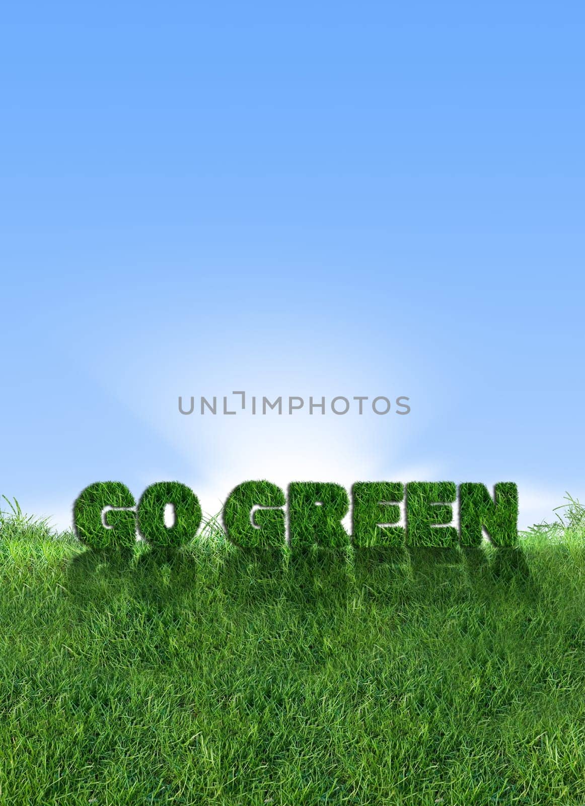 Textured go green sign over fresh grass. Clear blue sky background.