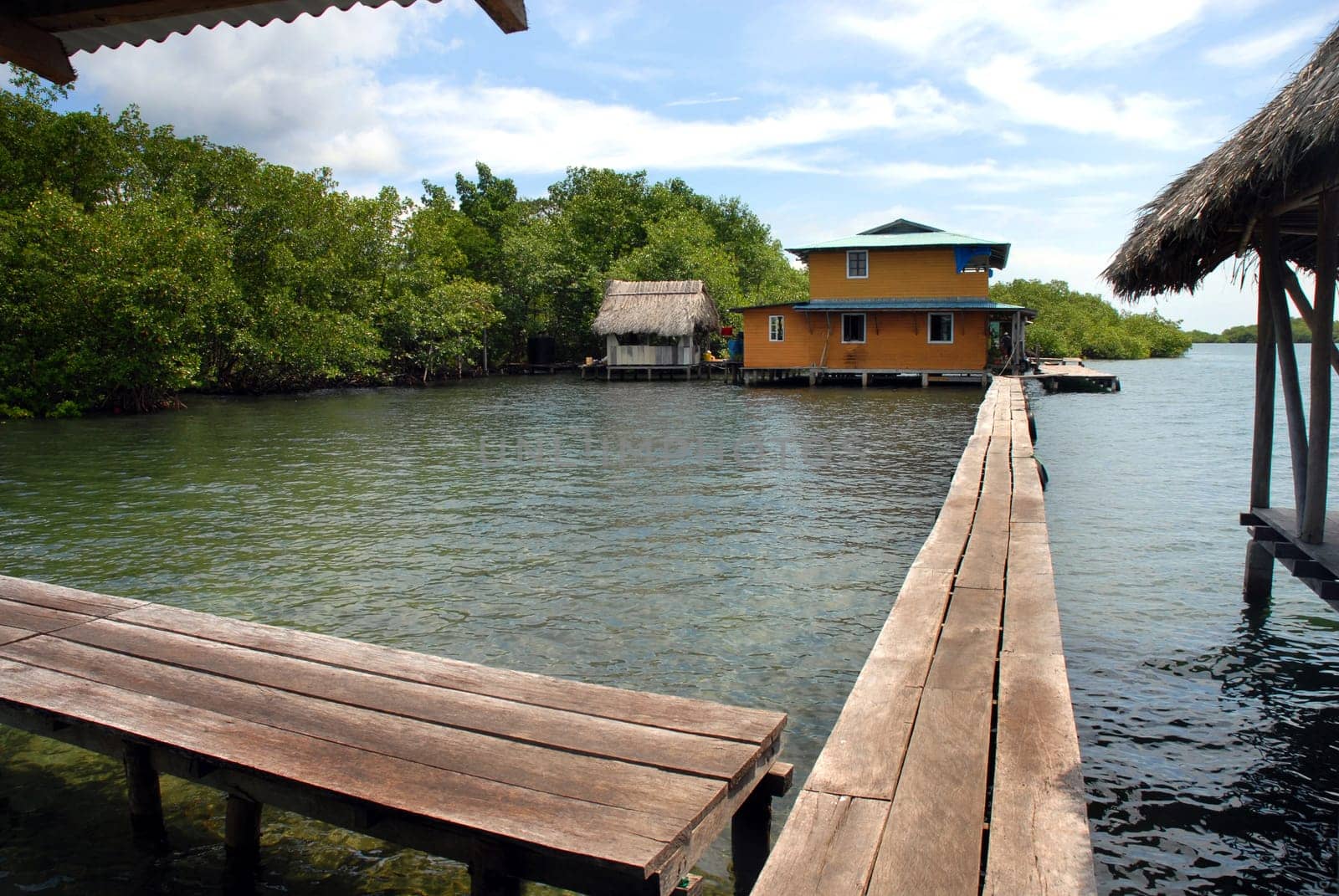Landscape of a resort with bungalows on the sea.