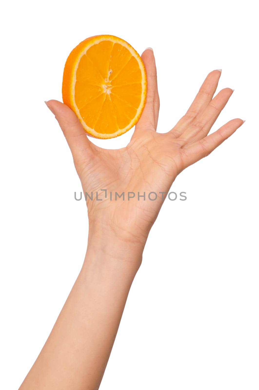 Slice of a fresh Sicilian orange in the hand