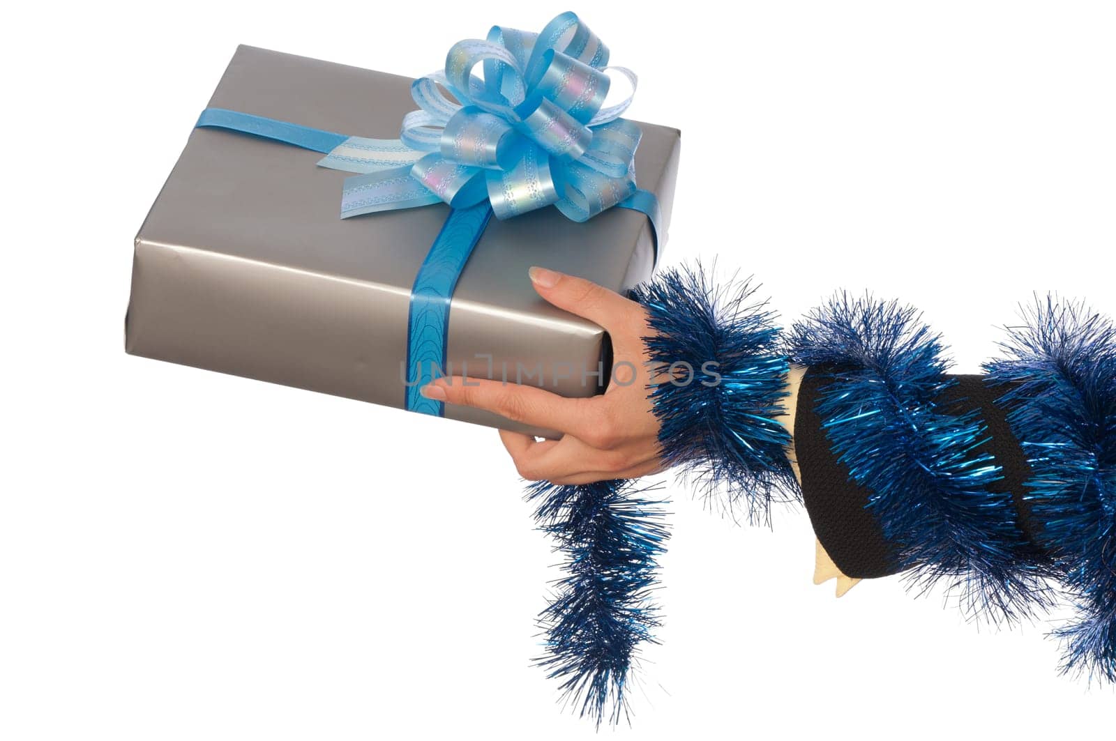 woman giving a silver box with blue bow as a gift for christmas