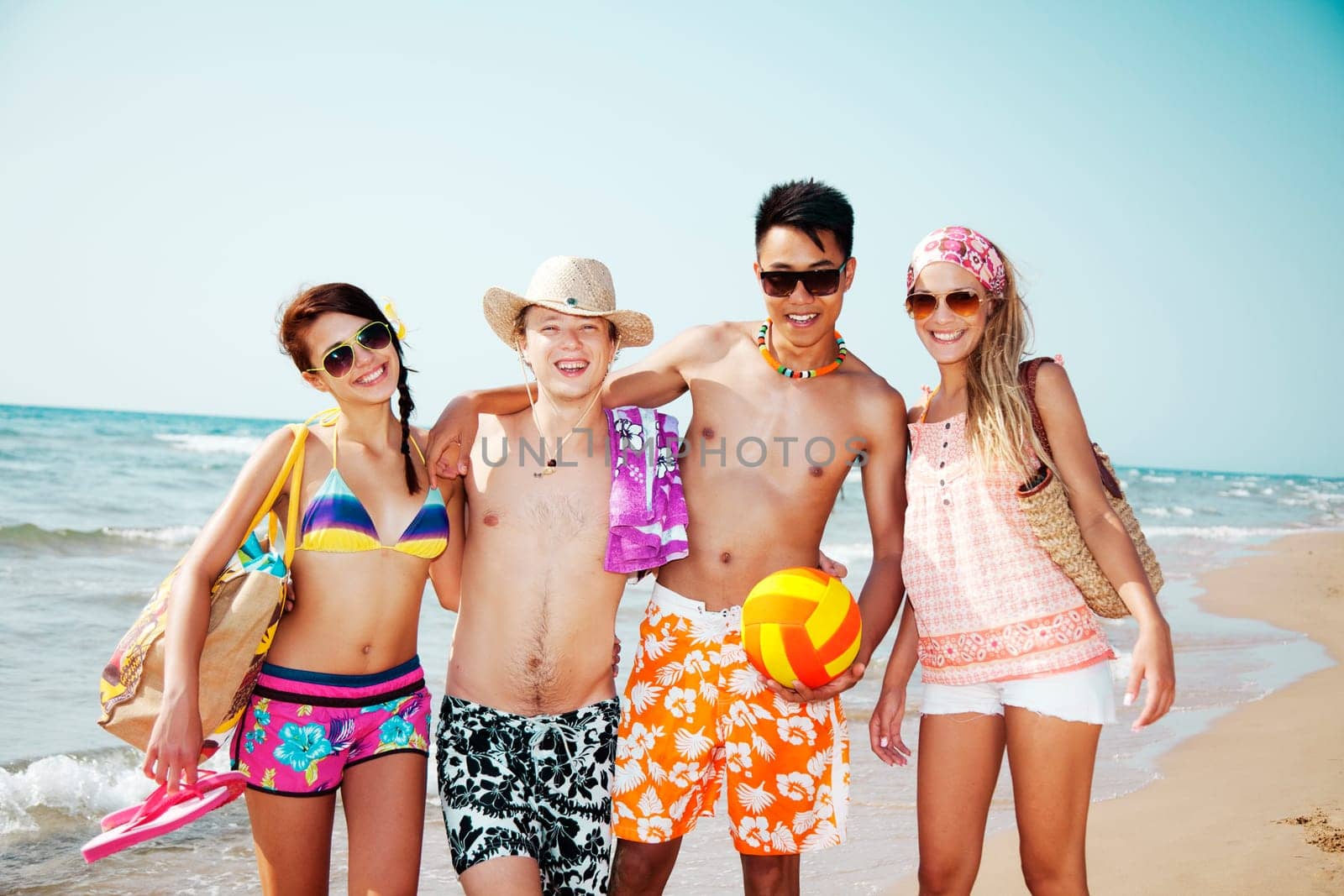 group of young people going to the beach