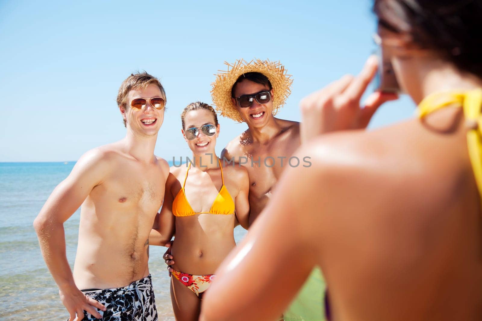group of young people taking a photograph