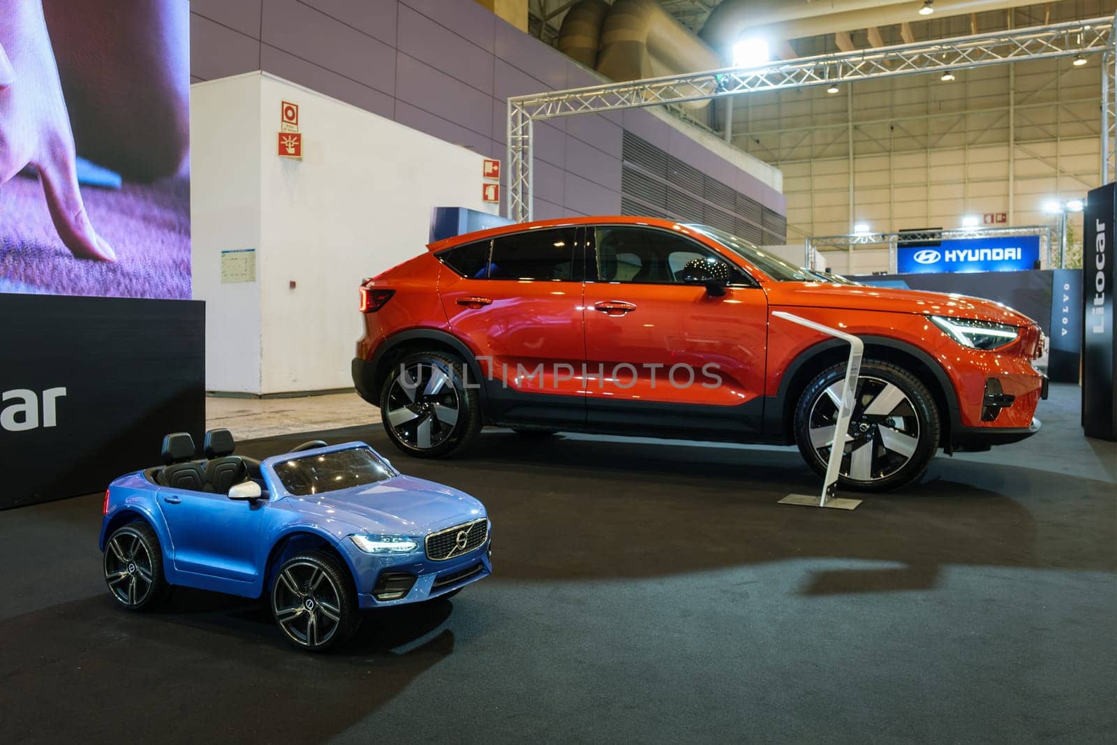 Lisbon, Portugal - May 12, 2023: Volvo C40 Recharge electric car and toy car on display at ECAR SHOW - Hybrid and Electric Motor Show