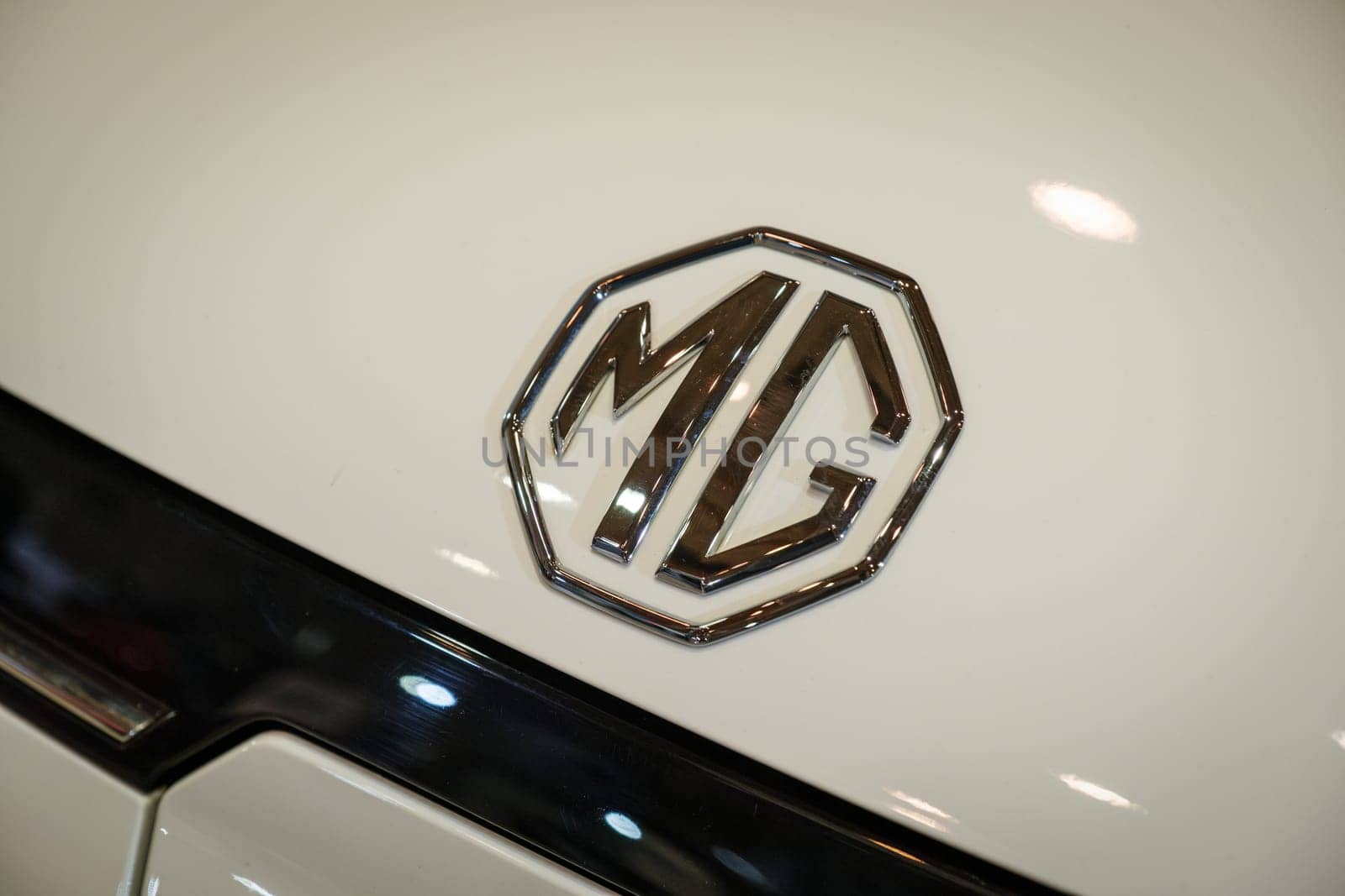 Lisbon, Portugal - May 12, 2023: MG electric car logo emblem close up