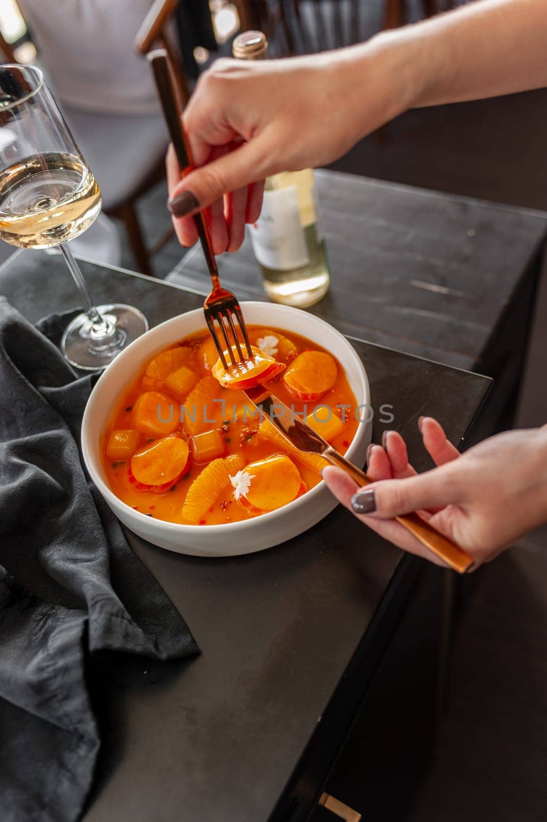 Salmon ceviche in jelly with orange and mango-passion fruit sauce. High quality photo