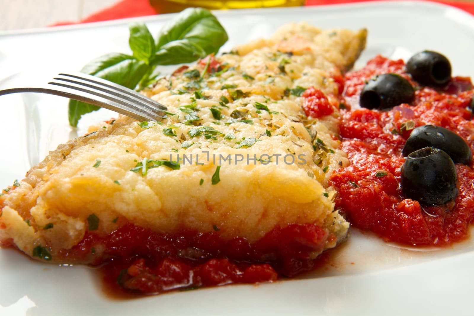 cooked cod loins with home made tomato sauce and oil