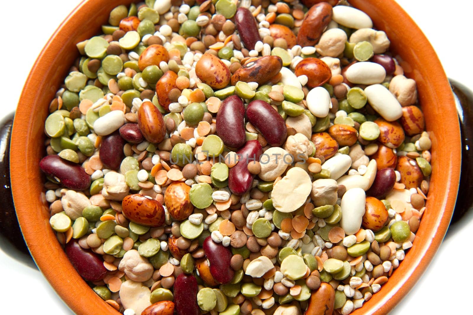 vegetables in crock pot on white background