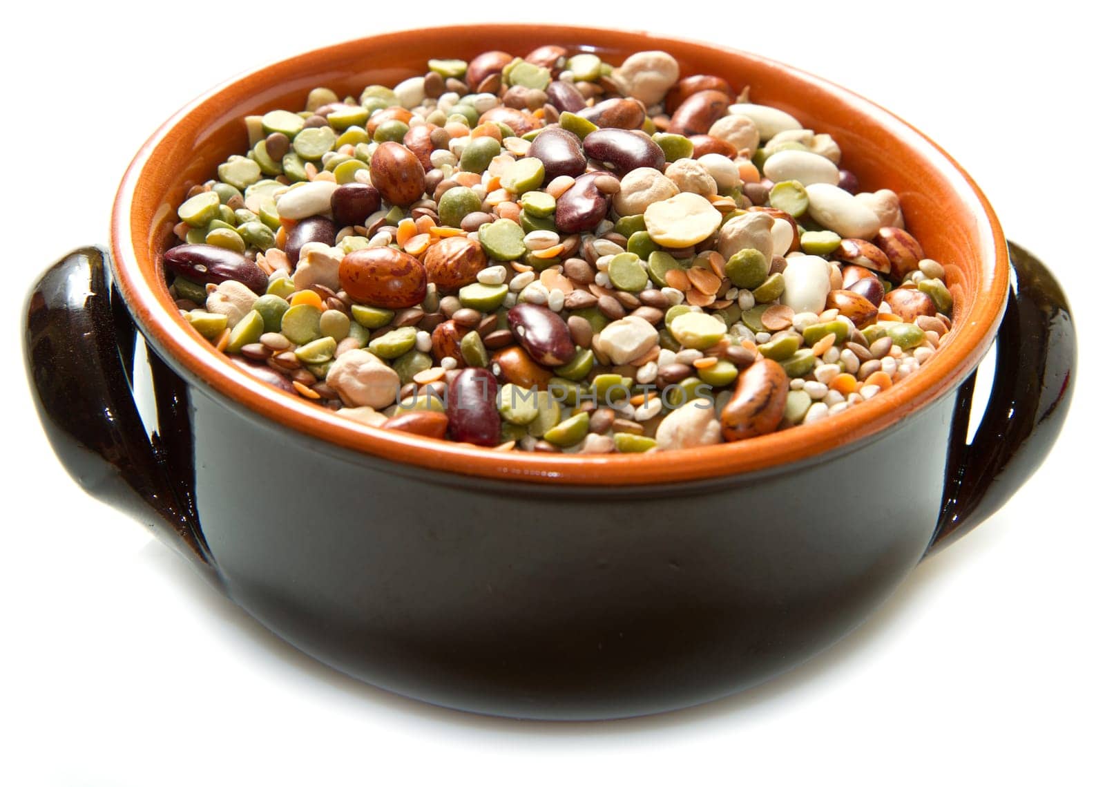 vegetables in crock pot on white background