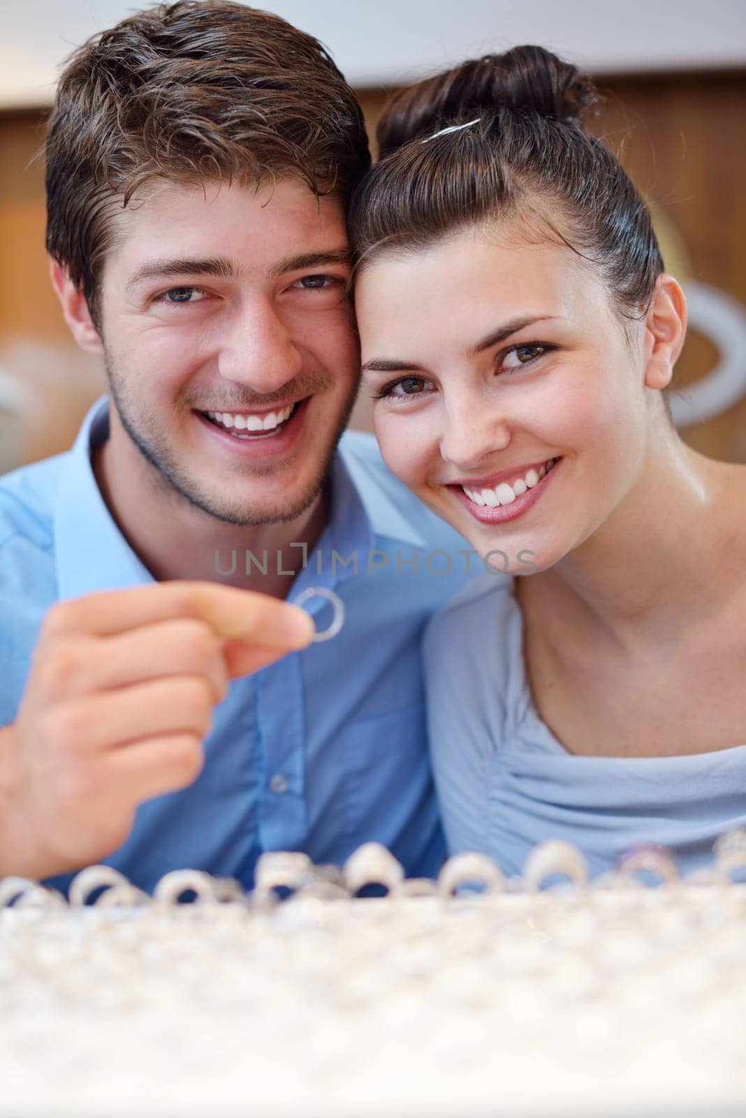 happy young romantic couple in love buy jewelry ring in luxury store